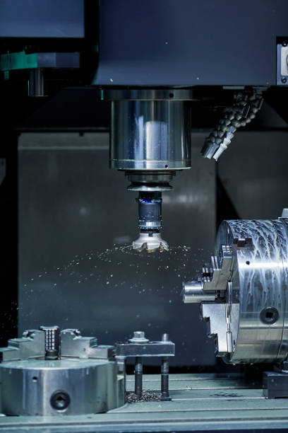 istock vertical milling machine close-up processes a part in production, modern equipment for metal processing 1902551507