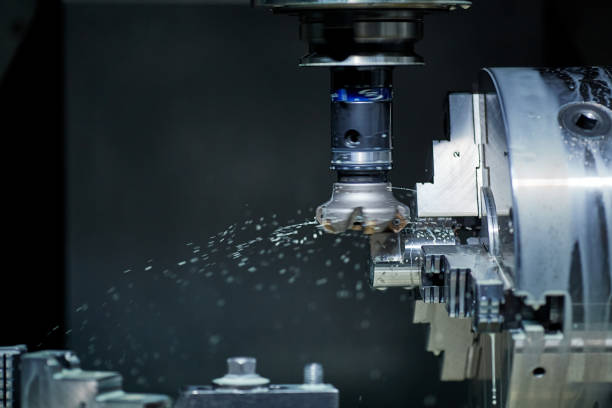 istock vertical milling machine close-up processes a part in production, modern equipment for metal processing 1902552015