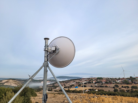 Telecommunication antenna for contacting satellites. Good for global communication issues, science and technology-related topics.