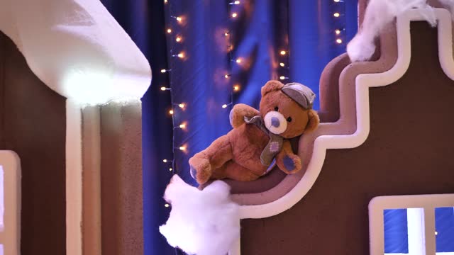 teddy bear in festive Christmas gingerbread decorations. Christmas photo zone