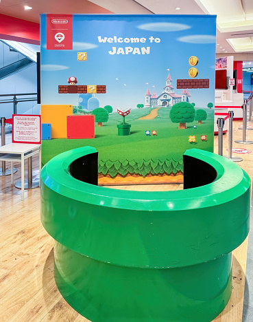 Tokyo, Japan. Dec 29, 2023. A Mario Bros green pipe photo booth display at the Narita Airport.