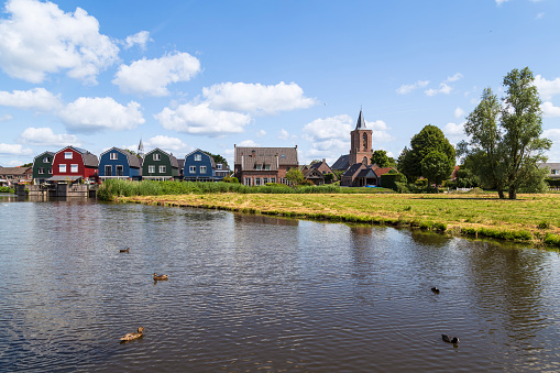 View of the rural village of Bunschoten-Spakenburg with the river in the foreground.