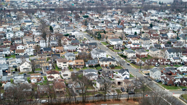 istock Homes in Middle Class neighborhood highway in background 1902658357