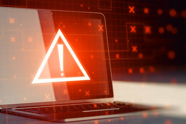 Laptop with creative red security alert on blurry background. Fraud and danger concept. 3D Rendering