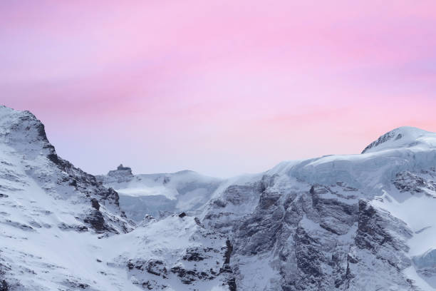 istock Tops of winter snowy higher mountains 1902706131
