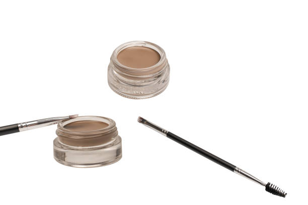 istock A brow pomade in blonde shade with brush isolated on a white background. 1902712472