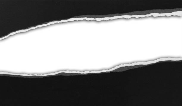 istock Gap in ripped black paper 1902713034