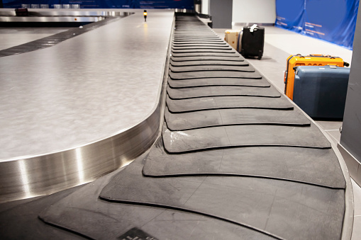 Airport suitcase conveyor track
