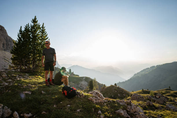 istock Father and son trail hiking on the Dolomites during summer 1902724383