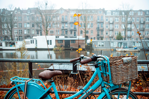 Blue old Bicycle in Autumn day in Amsterdam. Copy space