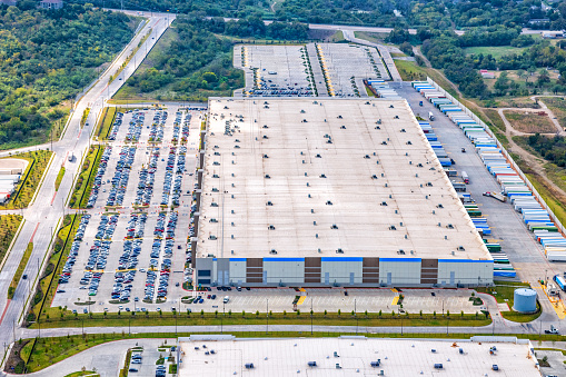Dallas, United States - October 21, 2020:  Aerial view of the large Amazon Corporation's DAL3 warehouse located in Dallas, Texas shot via helicopter from an altitude of about 700 feet.