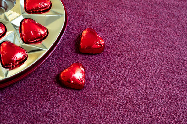 istock chocolate's box with red, heart-shaped chocolates 1902795535