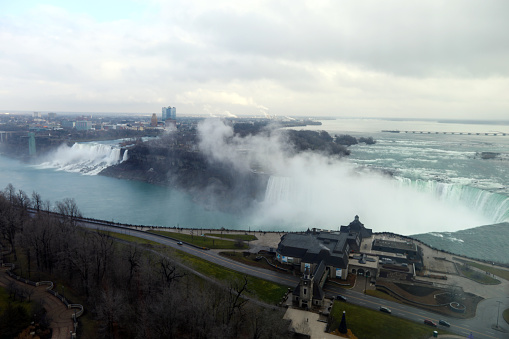 Horseshoe Falls in Niagara Falls, Ontario, Canada taken from the Embassy Suites Hotel top floor. Magnificent Niagara Falls in Canada. Border between Canada and the USA. Natural beauty. Power of Niagara River. Magical views of Niagara Falls from the hotel in Ontario, Canada. Amazing scenery. Main attraction in Canada and Ontario - Niagara Falls.