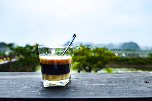Vietnamese Style Drip Coffee with Condense Milk, close-up in Vietnam