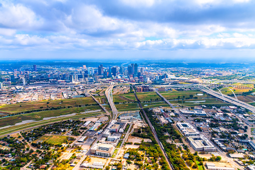 Aerial view of the modern skyline of Dallas, Texas shot via helicopter from several miles away at an altitude of about 1000 feet.