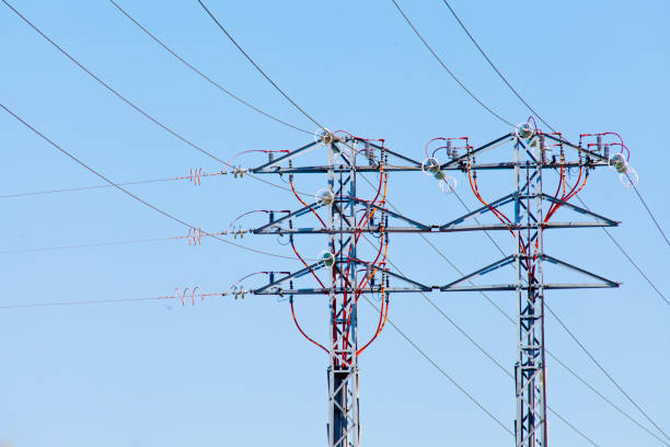 istock Large electricity pylons and cables at dusk. 1902930759