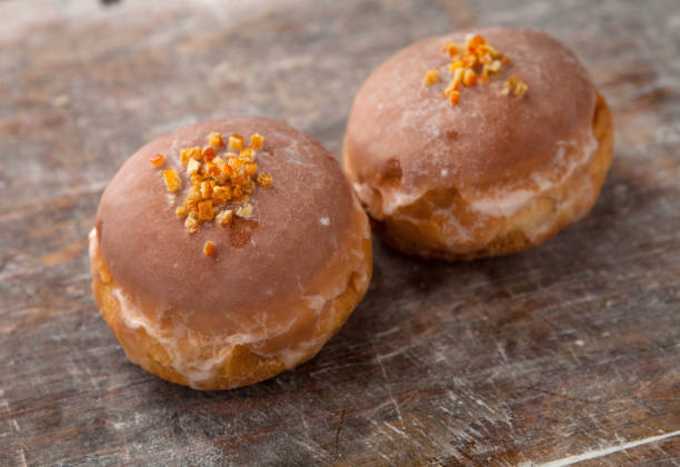 istock Fat Thursday. Classic golden donuts with icing. Donuts stuffed with marmalade. Polish tradition 1902941189