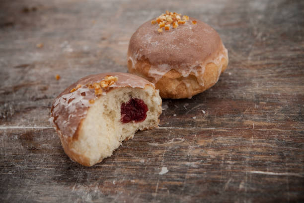 istock Fat Thursday. Classic golden donuts with icing. Donuts stuffed with marmalade. Polish tradition 1902942809