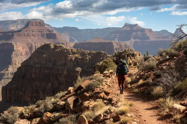 Photo of Backpacker HIkes Down The Hermit Trail Deeper Into The Grand Canyon