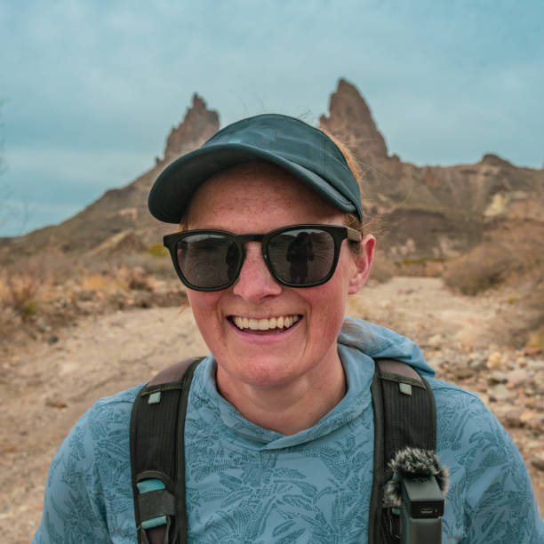 istock Female Hiker With Mules Ears Behind Her In Big Bend 1902965260