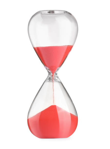 istock Hourglass with red flowing sand isolated on white 1902989056