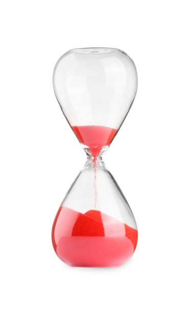 istock Hourglass with red flowing sand isolated on white 1902991734