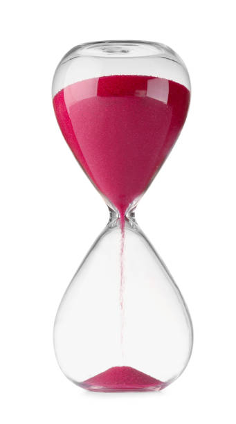 istock Hourglass with pink flowing sand isolated on white 1902992242