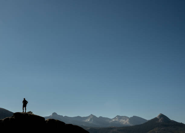 istock Silhouette of Hiker Standing at Yosemite Point 1902996237