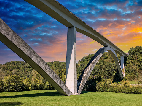 The Natchez Trace Parkway Bridge is a concrete double arch bridge located in Williamson County, Tennessee, 8.7 mi from the northern terminus of the Natchez Trace Parkway. It is 1,572 ft long and carries the two-lane Natchez Trace Parkway 145 ft over State Route 96 and a heavily wooded valley.