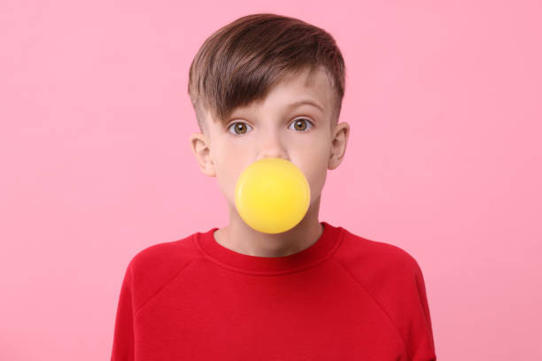 Close-Up Of Boy Licking Glass