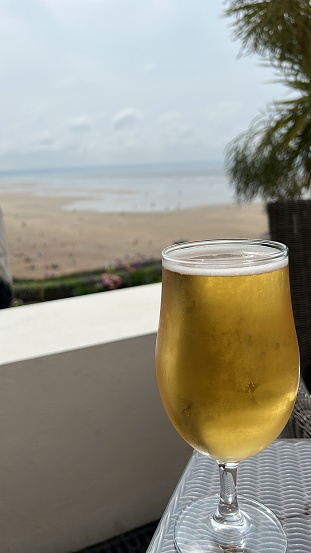 Cold glass of beer at beach