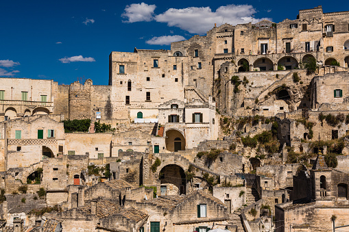 Matera, located in the Basilicata region of southern Italy, is a UNESCO World Heritage site known for its unique ancient cave dwellings carved into the rocky landscape. These cave homes, known as 