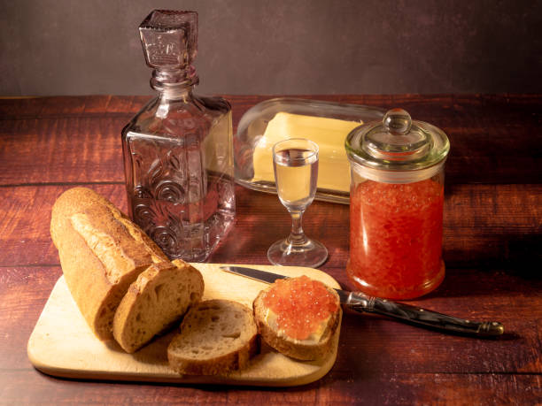 istock Antique-style still life with vodka and red caviar. 1903030066