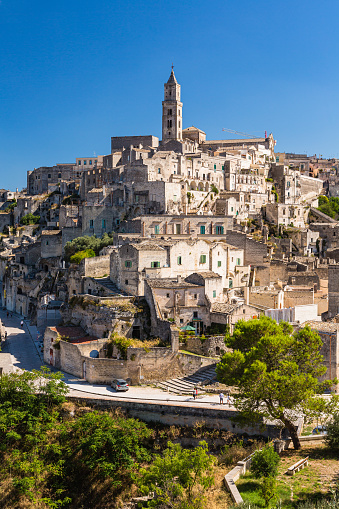 Matera, located in the Basilicata region of southern Italy, is a UNESCO World Heritage site known for its unique ancient cave dwellings carved into the rocky landscape. These cave homes, known as \