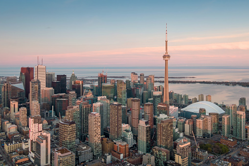 The CN Tower in Toronto, Ontario, Canada on a bright Autumn day with a cloudless sky.