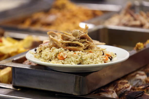 Chicken over rice standing on a restaurant counter