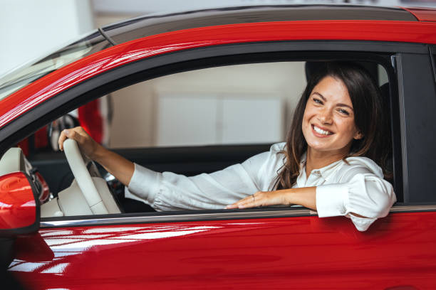 istock Young Woman Embracing Her New Car. 1903091576