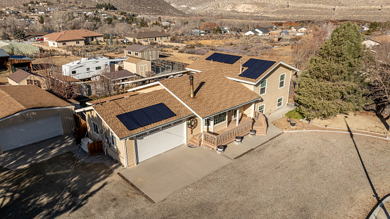 Aerial photo of a single family home in Nevada with rooftop solar panels installed.