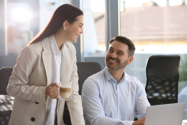 istock Colleagues working on laptop at workplace in office 1903149538