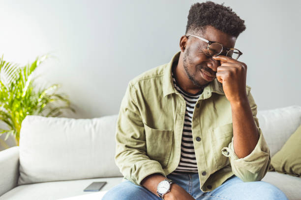 istock Black guy stressing and headache. Feeling sick and tired. 1903193944