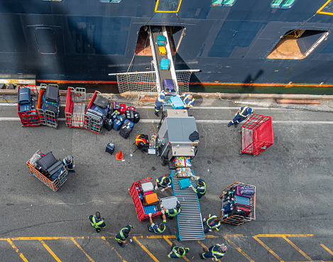 Passengers' luggage being security scanned before being loaded onto a cruise ship: Canada Place, Vancouver.