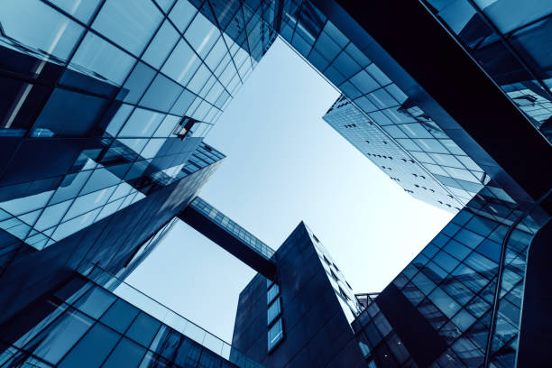 Low angle of tall corporate buildings skyscraper with reflection stock photo