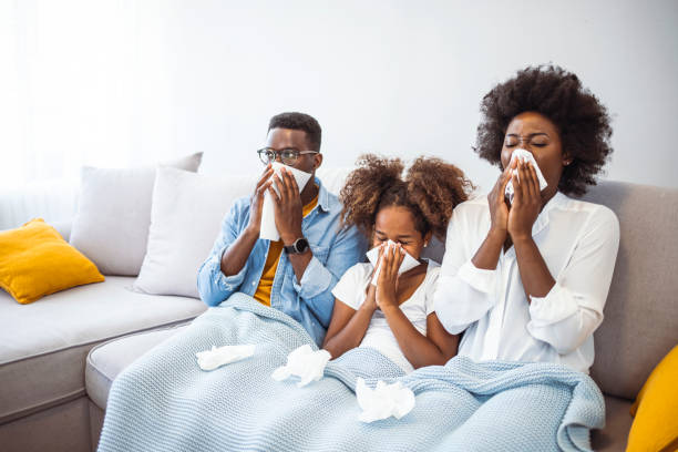 istock Sick family on bed. 1903247216
