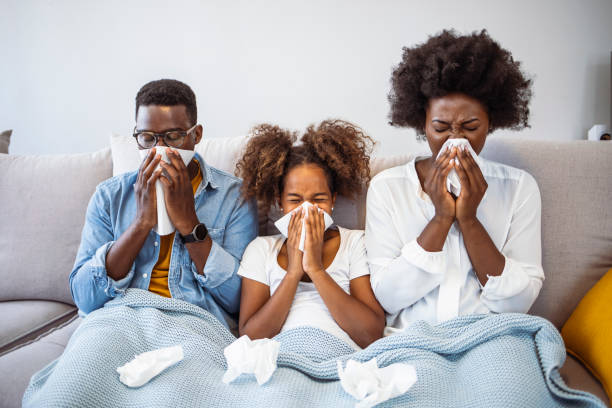 istock Sick family on bed. 1903247217