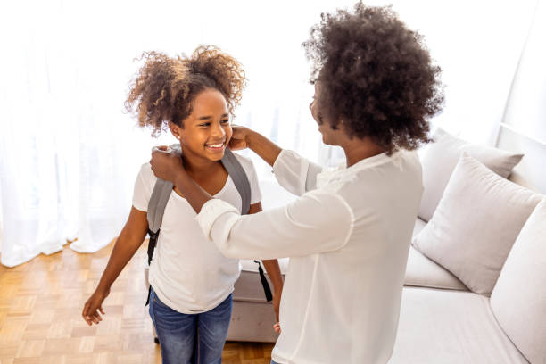 istock Mother taking daughter to school. 1903250305
