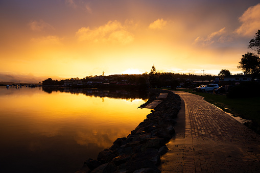 The sky is absolutely glowing as the shore of the lake glows with an amazing last moments of the golden sunset