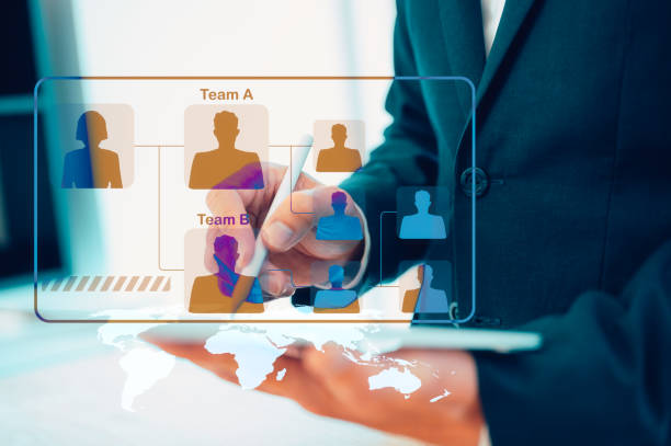 istock Human resource management system concept, leader in team businessman  or human resource manager analysing organisation chart choosing head of project manager 1903250875