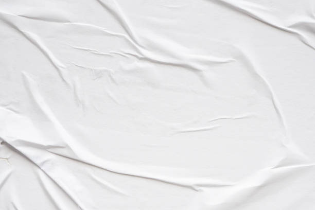 istock White blank crumpled and creased paper poster texture background 1903276893