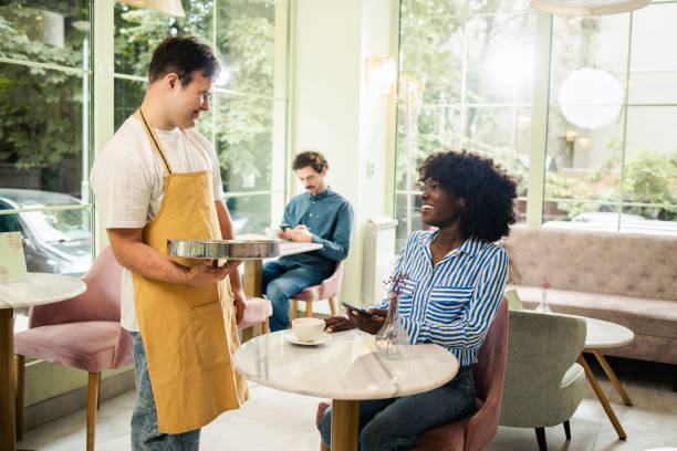 istock Young tourist is enjoying coffee at a famous cafe 1903278459