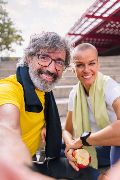 istock selfie of a senior man with his personal trainer 1903282232